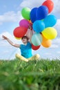 Happy child playing with colorful toy balloons outdoors Royalty Free Stock Photo