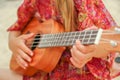 Happy child playing guitar by the sea greece on nature background Royalty Free Stock Photo