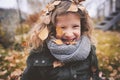 Happy child playing with leaves in autumn. Seasonal outdoor activities with kids Royalty Free Stock Photo