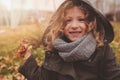 Happy child playing with leaves in autumn. Seasonal outdoor activities with kids Royalty Free Stock Photo