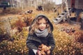 Happy child playing with leaves in autumn. Seasonal outdoor activities with kids Royalty Free Stock Photo