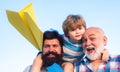 Happy child playing outdoors. Generations men. Freedom to dream - joyful kid playing with airplane against the sky - Royalty Free Stock Photo