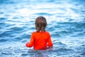 Happy child playing in the sea. Kid boy on the beach. Summer vacation and healthy kids concept. Royalty Free Stock Photo