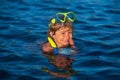 Happy child playing in the sea. Kid boy having fun on the beach. Summer vacation. Royalty Free Stock Photo