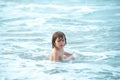 Happy child playing in the sea. Kid boy having fun on the beach. Summer vacation kids. Royalty Free Stock Photo