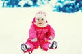 Happy child playing on snow in winter day Royalty Free Stock Photo