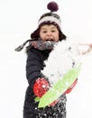 Happy child playing with snow in winter Royalty Free Stock Photo