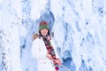 Happy child playing in a snowy forest Royalty Free Stock Photo