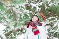 Happy child playing in a snowy forest Royalty Free Stock Photo