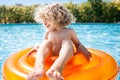 Happy child playing in swimming pool Royalty Free Stock Photo