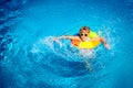 Happy child playing in swimming pool Royalty Free Stock Photo