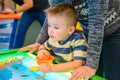 Happy child playing table air hockey Royalty Free Stock Photo