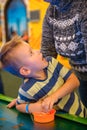 Happy child playing table air hockey Royalty Free Stock Photo