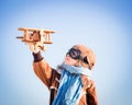 Happy child playing with toy airplane Royalty Free Stock Photo