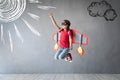 Happy child playing with toy jetpack Royalty Free Stock Photo