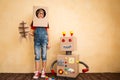 Happy child playing with toy robot Royalty Free Stock Photo