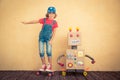 Happy child playing with toy robot Royalty Free Stock Photo