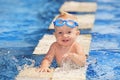 Happy child playing with water splashes in pool Royalty Free Stock Photo