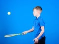 Happy child practice tennis. Little boy practice. Fitness diet brings health and energy. Gym practice of teen boy