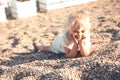 Happy child resting on beach carefree childhood summer lifestyle