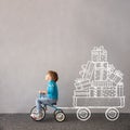 Happy child riding bike. Christmas holiday concept Royalty Free Stock Photo