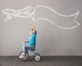 Happy child riding bike. Christmas holiday concept Royalty Free Stock Photo