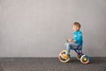 Happy child riding bike. Christmas holiday concept Royalty Free Stock Photo