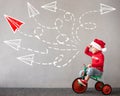 Happy child riding bike. Christmas holiday concept Royalty Free Stock Photo