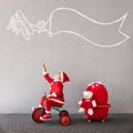 Happy child riding bike. Christmas holiday concept Royalty Free Stock Photo