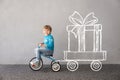 Happy child riding bike. Christmas holiday concept Royalty Free Stock Photo