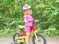 Happy child riding a bike in outdoor.