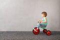 Happy child riding vintage trike