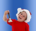 Happy child ringing hand bell Royalty Free Stock Photo