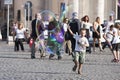 Happy child running towards a soap bubble