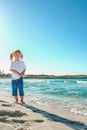 Happy child by the sea in the open air Royalty Free Stock Photo