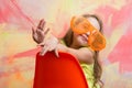 Happy child sitting on orange chair in summer glasses