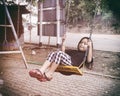 Happy child sitting swinging on swing at outdoor Royalty Free Stock Photo