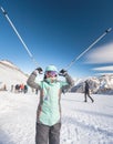 Happy child skier has fun in mountains holds ski poles. Royalty Free Stock Photo