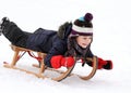 Happy child on sledge in winter Royalty Free Stock Photo