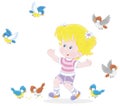 Little girl playing with merry small birds