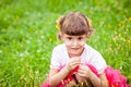 Happy child smelling wildflowers Royalty Free Stock Photo