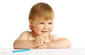 Happy child smile and draw with red crayon Royalty Free Stock Photo