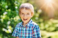 Happy child smiling outdoors on sunny day Royalty Free Stock Photo