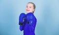 Happy child sportsman in boxing gloves. Fitness diet. energy health. workout of small girl boxer. punching knockout