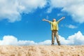 Happy child standing with hands raised up over sky Royalty Free Stock Photo