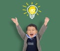 Happy Child student thinking and light bulb on the chalkboard . Cute little boy has an new idea. Innovation technology and educati Royalty Free Stock Photo