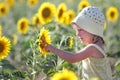 Happy child in sunflower field Royalty Free Stock Photo