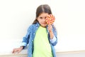 Happy child with sweet caramel lollipop having fun