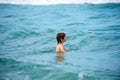 Happy child swimming in sea. Kid boy having fun on the beach. Kids summer vacation. Royalty Free Stock Photo