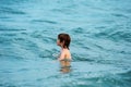 Happy child swimming in sea. Kid boy having fun on the beach. Kids summer vacation. Royalty Free Stock Photo